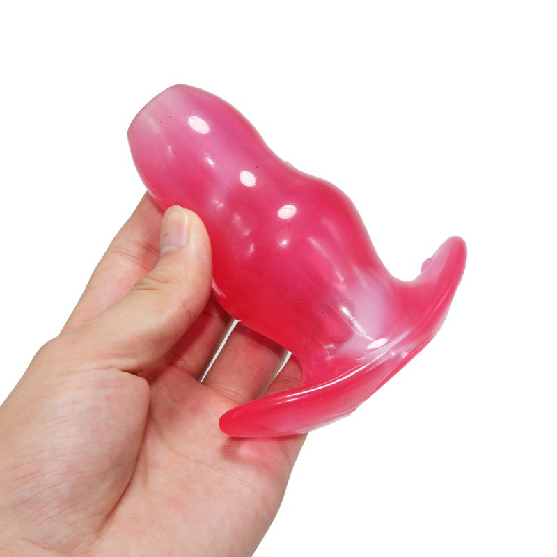 Smooth pink silicone sex toy for adult pleasure and intimate satisfaction.