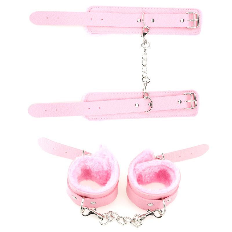 Pink furry handcuffs and ankle cuffs with adjustable straps for adult role play and BDSM bondage.