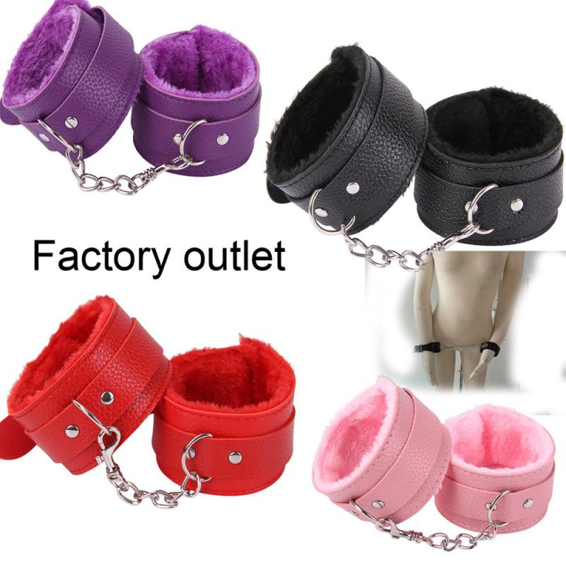 Purple furry leather handcuffs with chain for bondage, BDSM, and adult role-play fun.