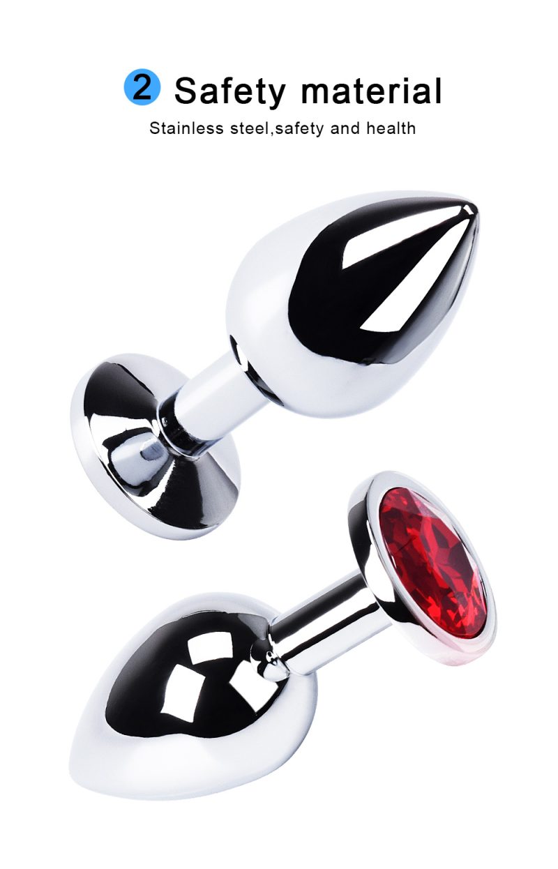 Shiny metal anal plugs with gemstone accents, designed for adult pleasure and safety.