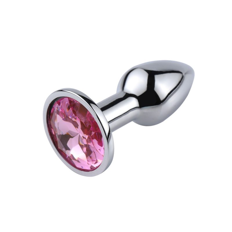 Shiny silver anal plug with pink gemstone top for luxury adult pleasure.