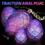 Large purple egg-shaped anal plugs with chain for BDSM and adult pleasure.