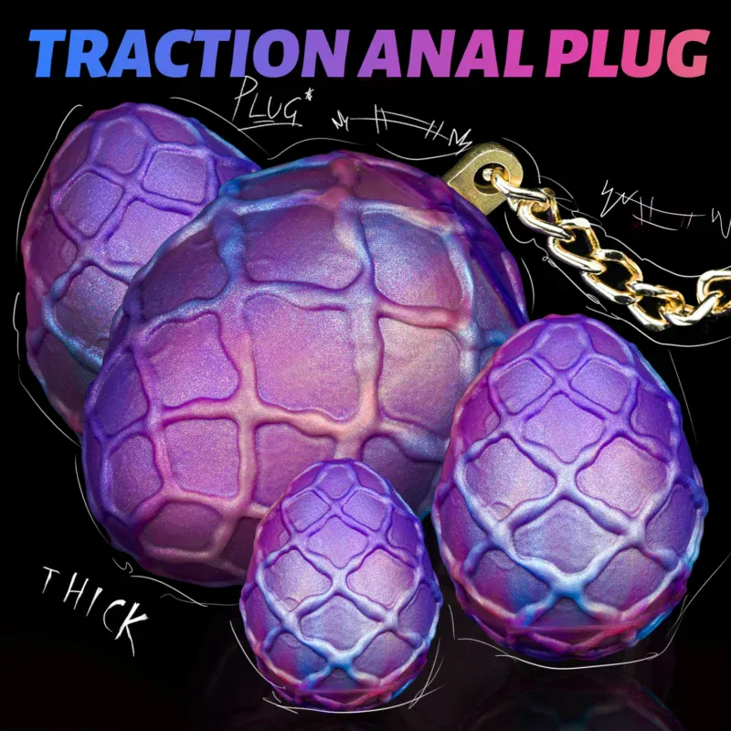 Large purple egg-shaped anal plugs with chain for BDSM and adult pleasure.