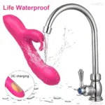 Waterproof pink vibrator under running water, rechargeable via USB.