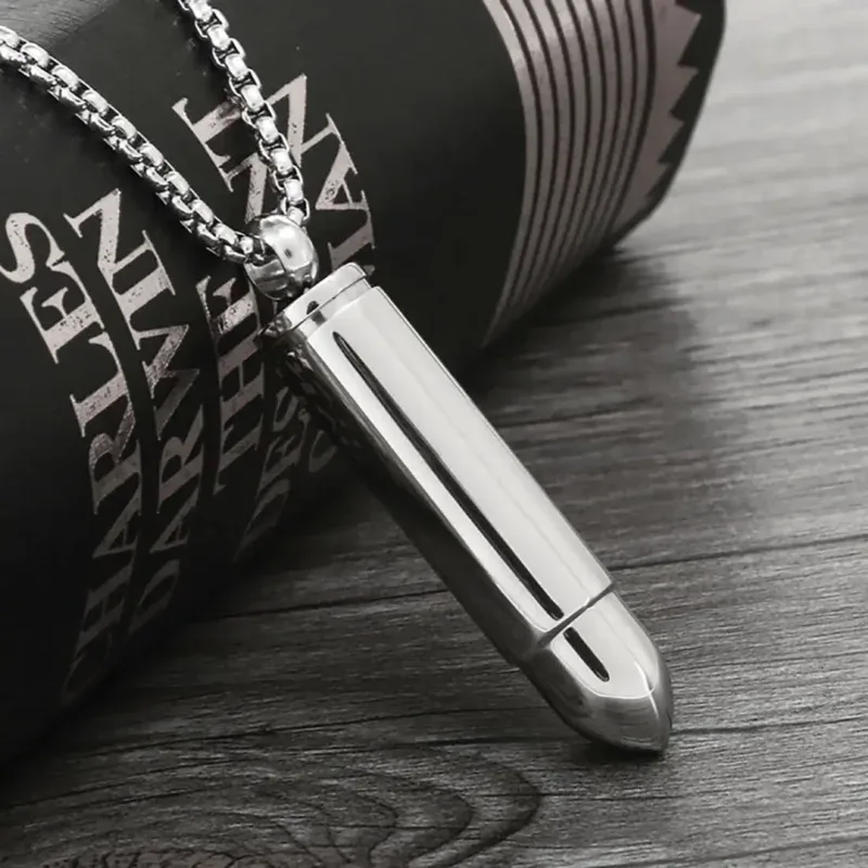 Elegant silver bullet pendant on a chain for stylish jewelry. Perfect accessory for modern fashion a.