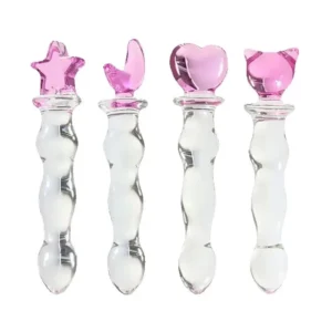 Set of four beaded glass dildos with pink charm handles in different shapes.