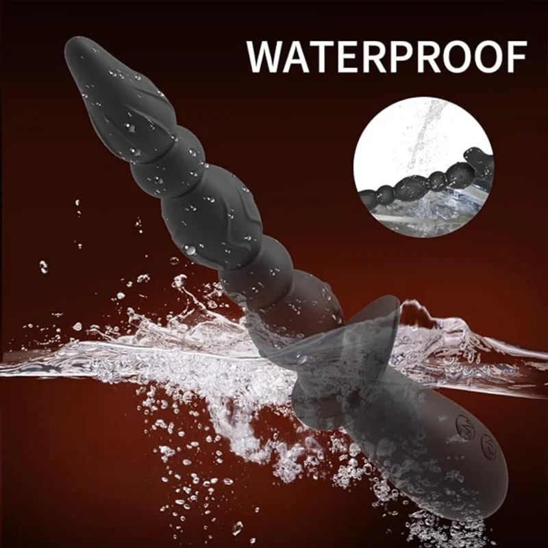 Waterproof black vibrating anal beads with prostate tip in water.