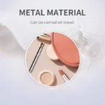 Travel-friendly metal beauty tools with compact case and lipstick.