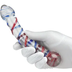 Glass dildo with red and blue swirl design held by a white-gloved hand.