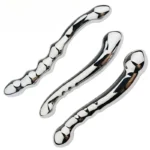Weighted stainless steel dual-end wand with curved design for adult pleasure.
